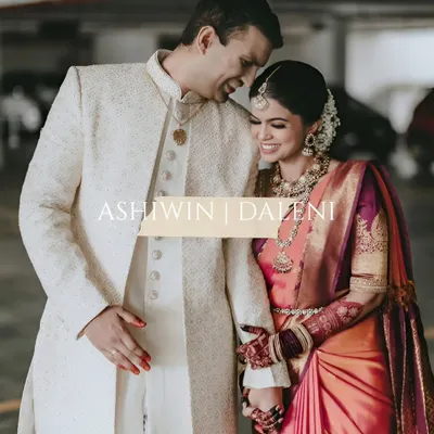The joy of a South Indian wedding is radiant and infectious. Here, the groom in his classic sherwani and the bride in her vibrant Kanjeevaram saree share a laugh. This photo captures the blend of rich tradition and modern love that makes each wedding unique.