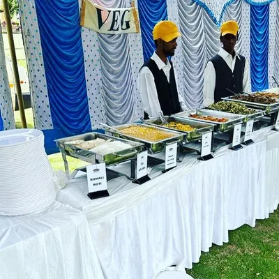 Our dedicated vegetarian buffet counter at an outdoor event. We offer a wide range of delicious veg dishes, from dal makhani to paneer preparations, all clearly labeled and served by our professional staff.