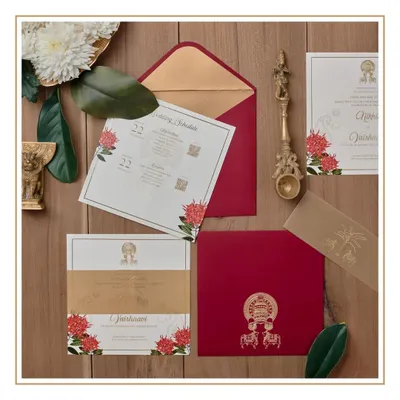 This invitation suite was created to represent the coming together of two South Indian cultures, Kerala and Karnataka. We used a rich red and gold palette and incorporated custom-illustrated motifs like Kathakali masks and temple elephants.