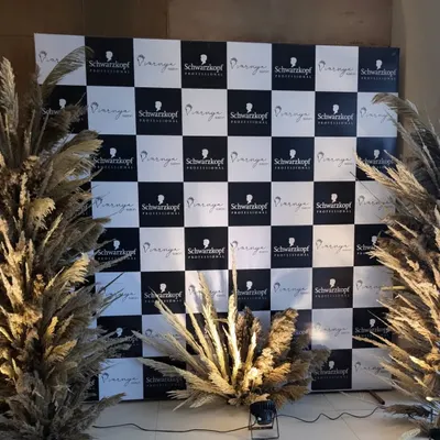 We create memorable photo opportunities that put your brand front and center. For this Schwarzkopf Professional launch event, we designed and installed a custom checkerboard backdrop, framed with stylish pampas grass for a modern, chic look.