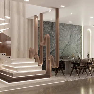 A stunning modern staircase design featuring illuminated steps and a sculptural partition that doubles as a work of art.