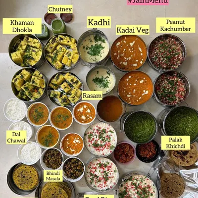 A grand Jain menu lunch spread I catered for 50 people. The feast included Khaman Dhokla, Kadhi, Kadai Veg, Palak Khichdi, Curd Rice, Theplas, Parathas, and a variety of other delicious dishes.