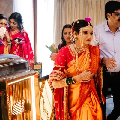 As the bride walks out, her mother is overcome with emotion in the background. These are the split-second, layered moments I look for, telling multiple stories in a single frame.