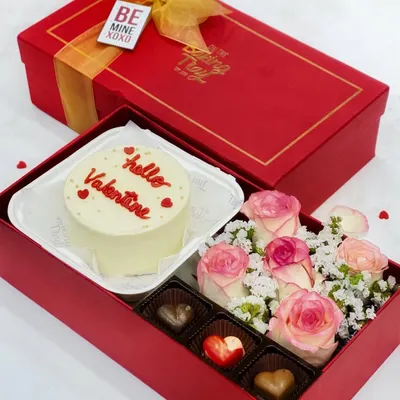 The ultimate Valentine's Day gift! This beautiful hamper includes a "Hello Valentine" bento cake, artisan chocolates, and a bouquet of fresh roses, all packed in a luxurious gift box.