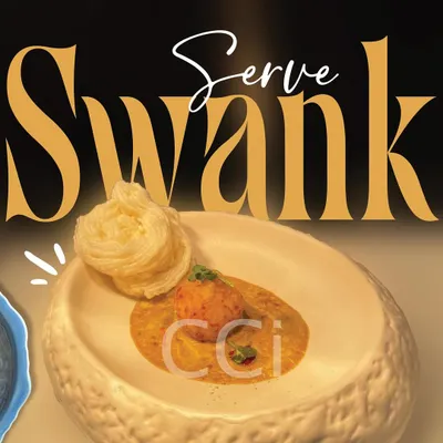 We serve swank. This artfully plated dish, featuring a delicate nest-like garnish, embodies our commitment to redefining taste with style and elegance.