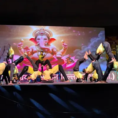 A dynamic moment from my students' performance at Talkatora Stadium. This complex pose demonstrates the advanced acrobatic yoga skills and teamwork we cultivate.