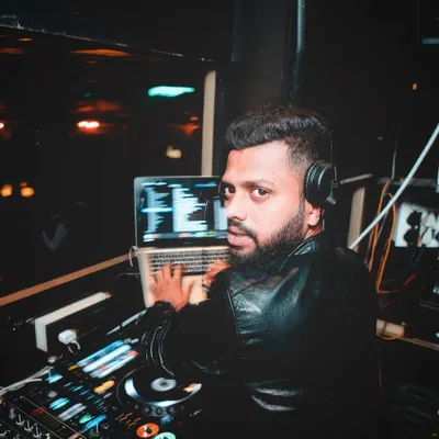 This is my second home: the DJ booth at Opa Bar and Cafe. As the head resident DJ, I'm here every weekend, shaping the venue's sound and making sure every Friday night is a massive one for the Mumbai nightlife scene.
