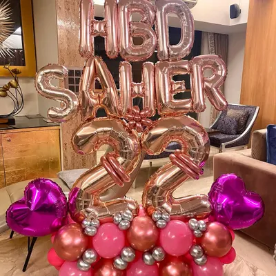A fun and girly birthday balloon bouquet for a 22nd birthday. I used a mix of rose-gold, pink, and silver balloons to create this large, deliverable arrangement.