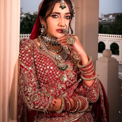 A close-up of our royal bride in red. The focus here is on creating a powerful statement with defined, kohl-rimmed eyes and flawless skin that glows under any light.