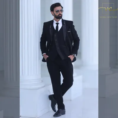A classic black three-piece suit that exudes sophistication. This pre-loved tuxedo is perfect for a reception or formal engagement party.