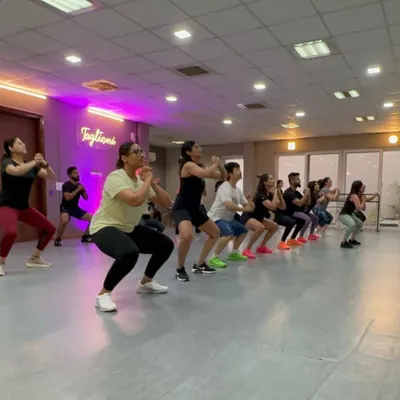 We always incorporate strength training moves like squats into our warm-ups. This helps activate the muscles and prepare your body for the dance workout ahead.