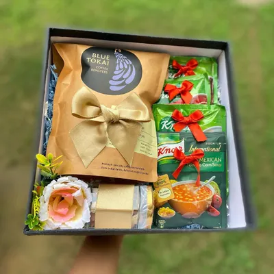 This "We Care" hamper is designed to offer comfort and warmth. It includes premium Blue Tokai coffee, nourishing Knorr soup packets, and a sweet treat, making it a perfect gesture to show support for a colleague.