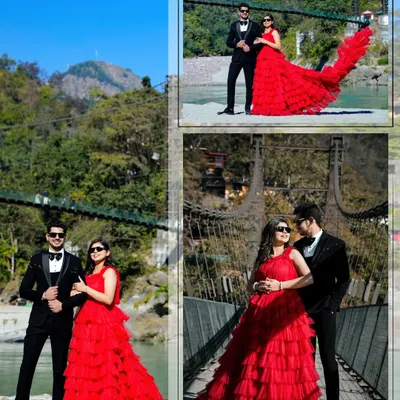 A stunning shot on a suspension bridge in Rishikesh. The bride's vibrant red gown creates a breathtaking contrast against the lush green mountains and blue sky, making for a truly cinematic image.