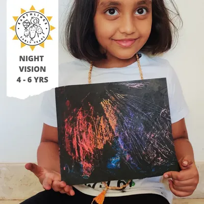 This proud artist is showing off her "Night Vision" creation. This scratch art activity simulates how nocturnal animals see in the dark and is a fun way to explore color, texture, and jungle themes.