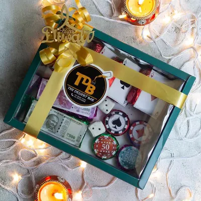 Get ready for your Diwali party with my edible Poker Set hamper. This creative gift box includes fudgy brownie playing cards and chocolate-enrobed biscuit poker chips, perfect for a night of fun.