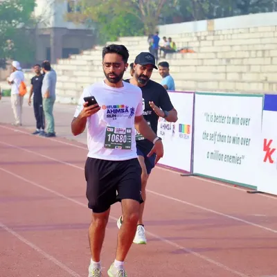 Here I am on the track during the JITO Ahimsa Run in New Delhi. This race was a personal victory, proving that consistent training pays off. My coaching focuses on building the endurance and form needed for a strong finish.