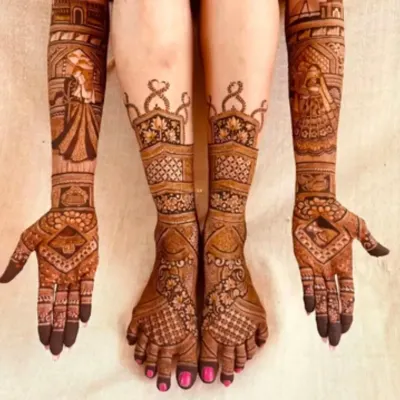 A stunning example of full bridal mehandi, with coordinated designs covering the hands, arms, and feet for a complete, breathtaking look.