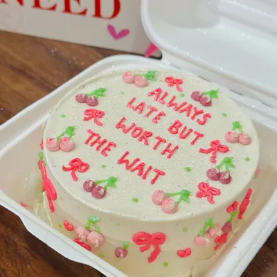 A cute and cheeky bento cake that’s perfect for your friend who is always fashionably late. This design features tiny hand-piped cherries and bows on our signature vanilla buttercream.