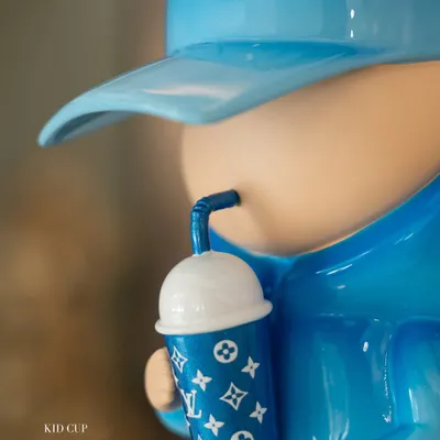 A close-up of the 'Kid Cup (Aqua Blue)' sculpture by the iconic duo Leo and Steph. We are thrilled to welcome their uber-cool creations to India for the first time, exclusively at our gallery.