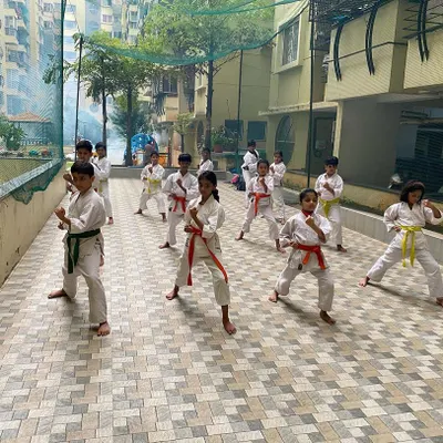 Students at our Purva Belmont dojo practice their basic stances and punches in an outdoor session. Strong Kihon is the key to progress in both Kata and Kumite.