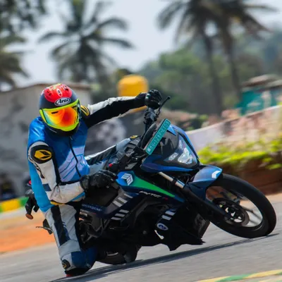 Leaning an electric race bike into a corner during a test session. As a rider coach, I help racers adapt their skills to the instant torque and different feel of EV motorcycles.