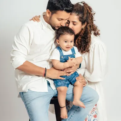 An intimate studio family portrait capturing the tender love between parents and their baby boy. We focus on creating a comfortable space for these genuine moments of connection.