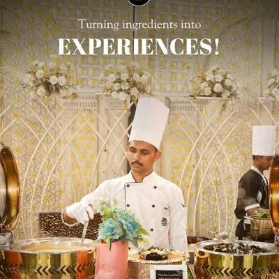 Turning ingredients into experiences. A shot of my chef at a beautifully decorated buffet station, ready to serve guests with professionalism and a smile.
