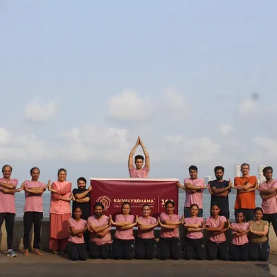 Our students gather for a group practice at Mumbai's iconic Marine Drive, near our center. We believe in creating a strong community, finding moments of shared peace and discipline amidst the energy of the city.