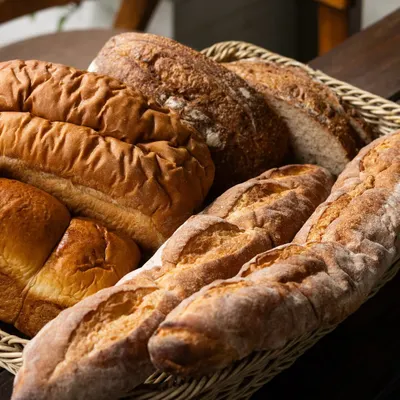The smell of fresh bread has a way of making any place feel like home. This basket of assorted loaves, including baguettes and sourdough, is baked with care for my sandwiches and bruschettas.