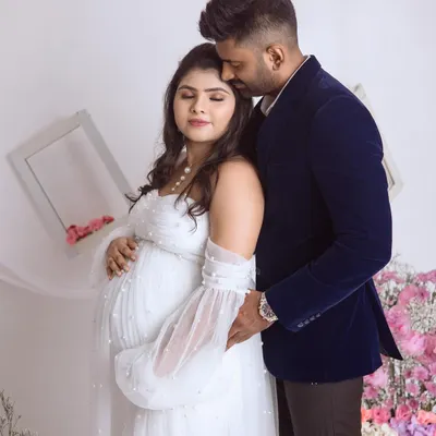 A quiet, tender moment between the parents-to-be. We love capturing these gentle embraces during our couple maternity shoots.