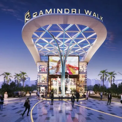 The grand entrance of Ramindri Walk in Guwahati, designed to be a hyper-connected mall. The tree-like central column and expansive glass canopy create a welcoming and impressive entry point for visitors.