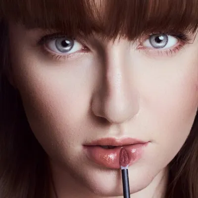 This is my go-to lighting for makeup brands. It's a clean, commercial setup that renders skin tones accurately and keeps the focus on the product, in this case, a lip gloss application.