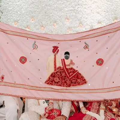 The antarpat is the sacred curtain that separates the couple before they unite. I craft these with beautiful illustrations, like this one depicting the wedding ceremony itself, to make the moment even more memorable.