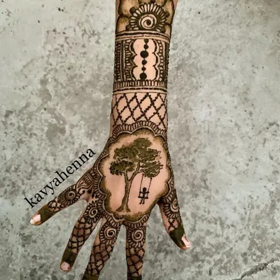 This design, featuring a person on a swing under a tree, was created for a client's party. It's a perfect example of how we can turn a personal memory into a unique piece of custom story henna.