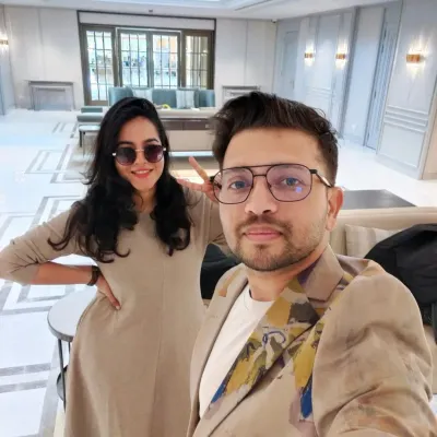 A quick selfie of us, Varsha and Vivek, at a beautiful wedding venue. We're always excited to get started on a new painting.