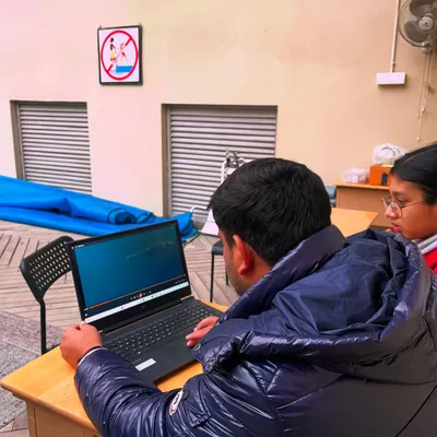We believe in learning to walk before you run. Here, I'm using video playback to analyze a swimmer's technique. This focus on biomechanics is what separates good swimmers from great ones.