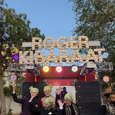 A Baraat should be an event in itself. For this wedding in Jaipur, we created a custom mobile DJ truck with a "ROGER KI BARAAT" marquee sign to make the procession feel like a festival.