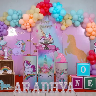 A whimsical unicorn wonderland. This pastel-themed first birthday setup shows how we capture the full scope of your party's decor.