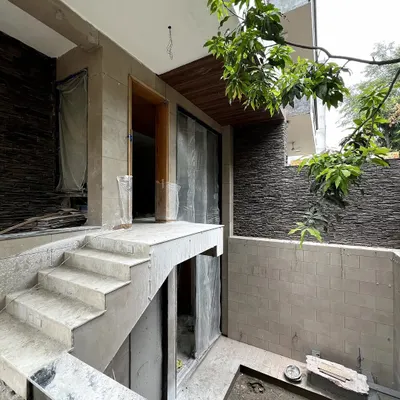 A glimpse into the construction of a residence at DLF Phase 1. Here, you can see the formation of the structure, where my design focuses on the juxtaposition of balconies and projections to create a dynamic and detailed facade.