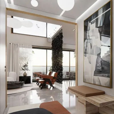The entrance foyer of the Renaissance Bellevue penthouse in Malleshwaram. Polished floors, high ceilings, and curated art create a grand first impression, setting the tone for a home that is both elegant and simple.