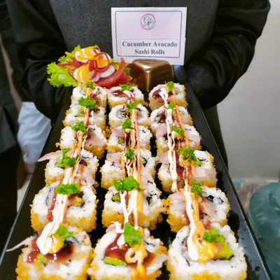 Sushi roll-call: Our Cucumber Avocado Sushi Rolls are a crowd favorite, beautifully presented and drizzled with spicy mayo and teriyaki sauce for that extra kick of flavor.