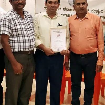 Pictured with officials from the Chickballapur District Chess Association and the UKCA Secretary. These strong relationships are key to organizing officially sanctioned district and state-level events.