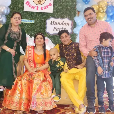 A full family group photo at a Mundan Party, capturing everyone dressed in festive attire to celebrate the special occasion.