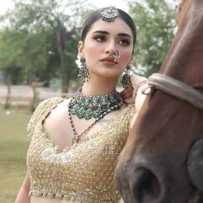 A model in stunning bridal attire poses with one of my horses. The combination of high fashion and the natural beauty of the horse creates a powerful image.