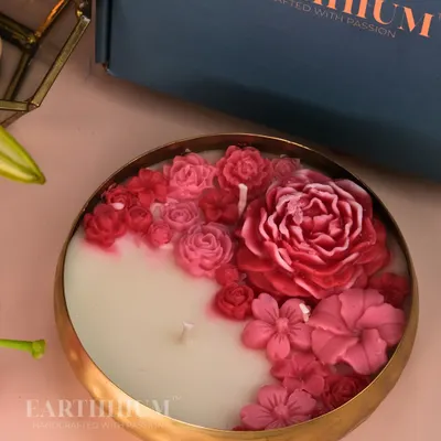 A close-up of my floral Urli candle, showcasing the intricate details of each hand-sculpted flower. This multi-wick candle is perfect as a centerpiece for a dining table or coffee table.
