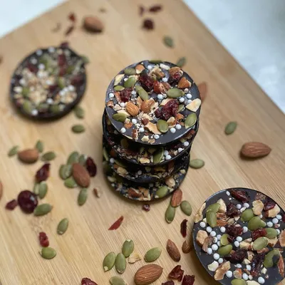 Our Almond Berry Discs are crunchy dark chocolate medallions loaded with roasted almonds, pumpkin seeds, and tangy dried cranberries. A healthy and delicious treat.