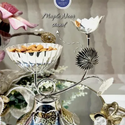 Gift elegance with my Maple Noor stand. This premium silver-coated dry fruit holder is a stunning blend of tradition and luxury, perfect for making festive celebrations unforgettable.