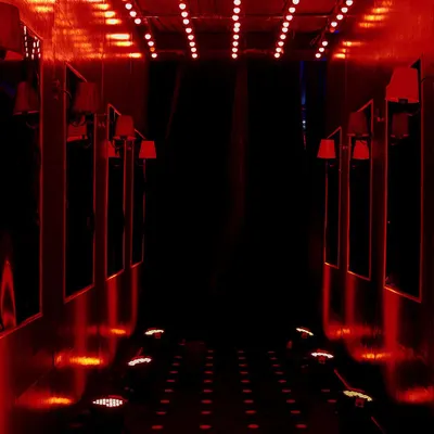 The 'Red Pill' path within our Matrix-themed tunnel experience. We used dramatic red uplighting and repeating floor lights to create a bold, high-energy corridor for guests at the EO Noida President's Gala.