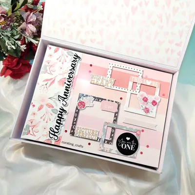 I was honored to create this huge A4 scrapbook for a couple celebrating their 25th wedding anniversary. The cover is designed with elegant floral patterns and multiple frames to begin their story.