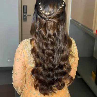 The back view of this soft glam look, showing the beautiful, bouncy waves. I added a delicate butterfly accessory to the half-up twist for a touch of whimsy.